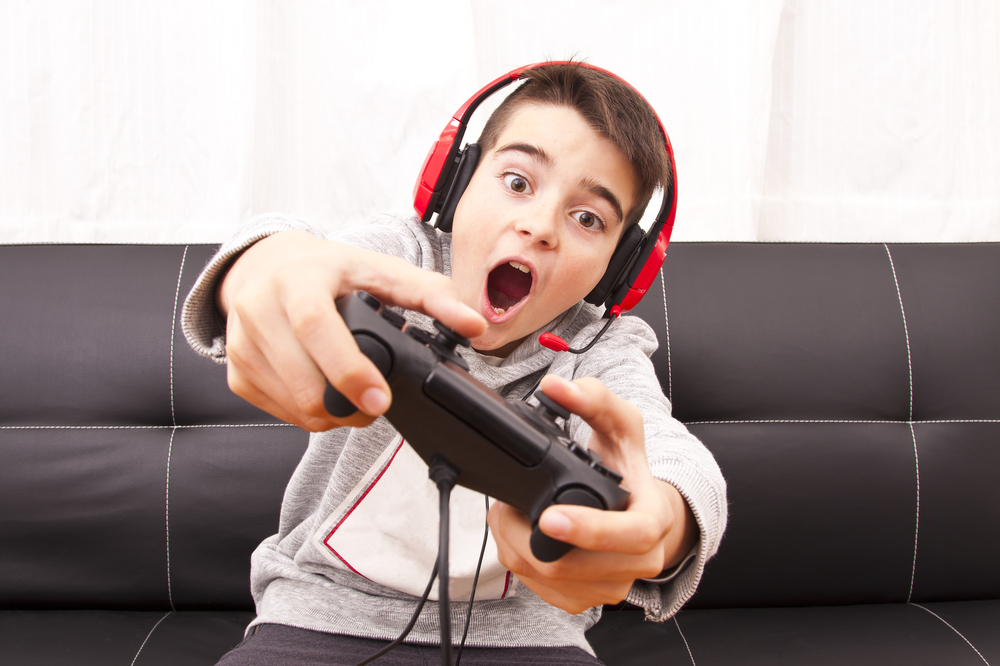 Child,Playing,With,Game,Console