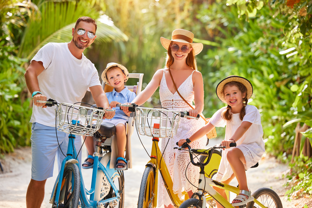 Happy,Family:,Parents,And,Kids,In,Summer,Outfits,Enjoying,Bicycle