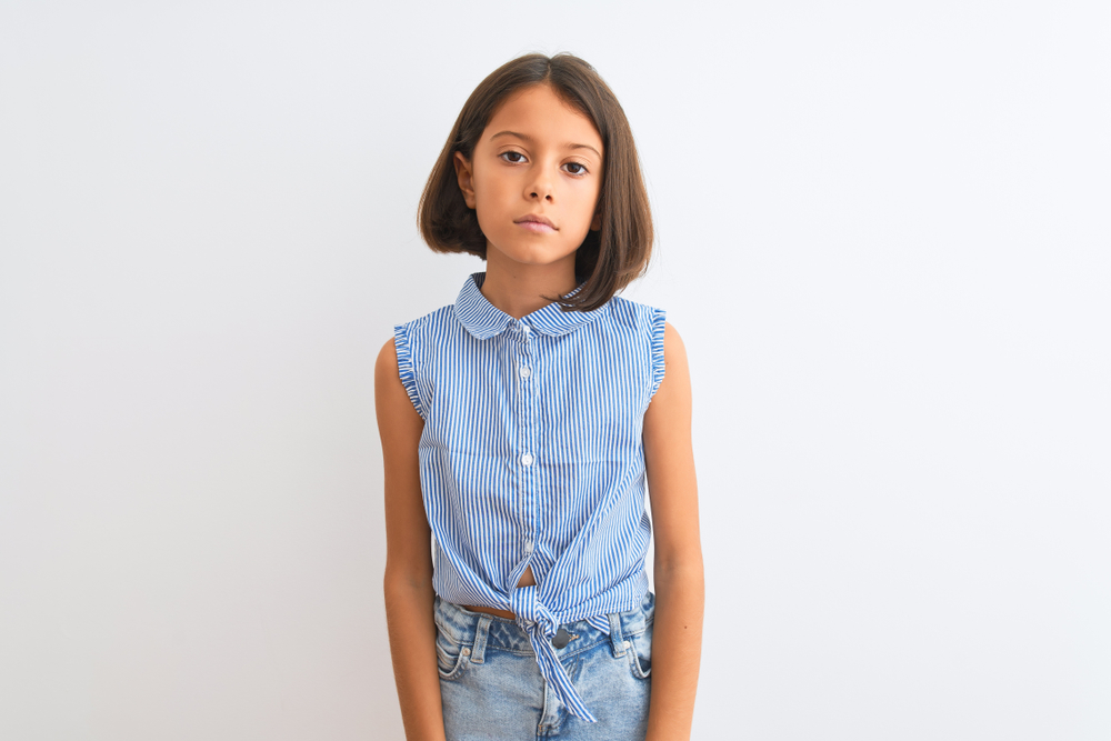 Young,Beautiful,Child,Girl,Wearing,Blue,Casual,Shirt,Standing,Over