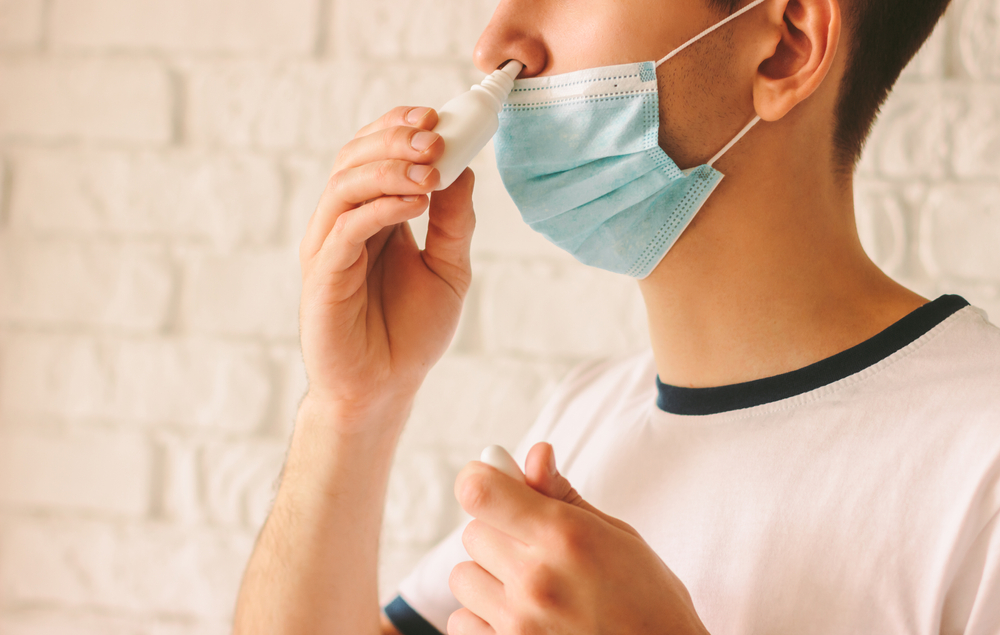 Closeup,Of,Young,Man,With,Sickness,Using,Nasal,Spray,For