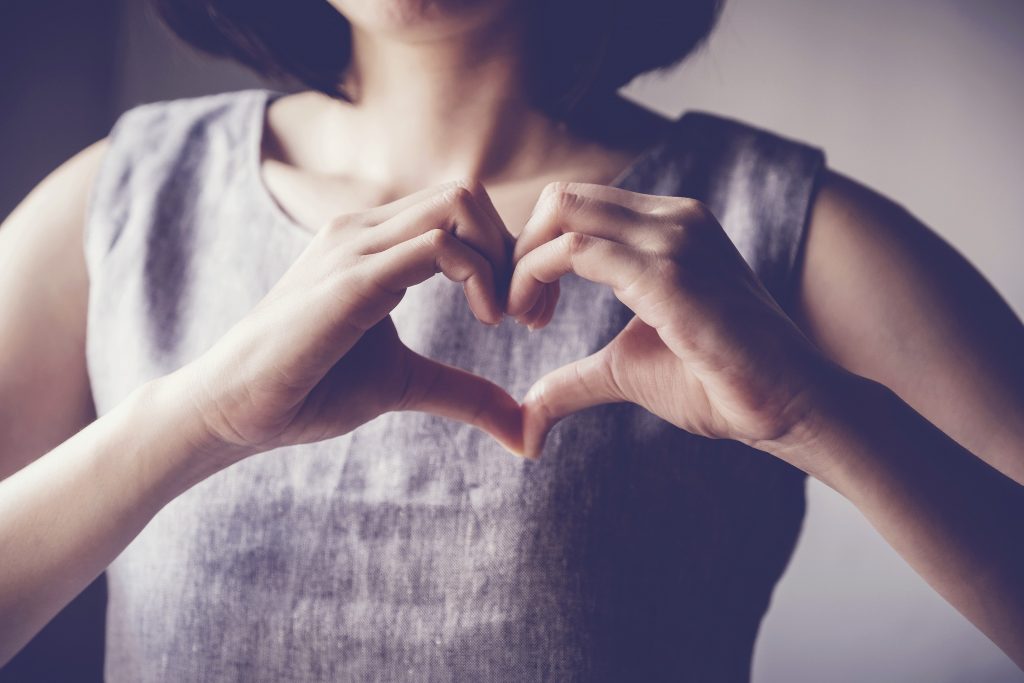 young woman making her hands in heart shape, heart health insurance, social responsibility, donation charity, world heart day, International Women's Day, appreciation, gratitude, thankful, hope