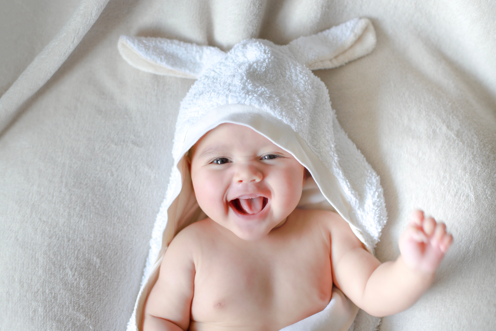 Adorable,Newborn,Baby,Wrap,By,White,Rabbit,Towel,With,Smiling