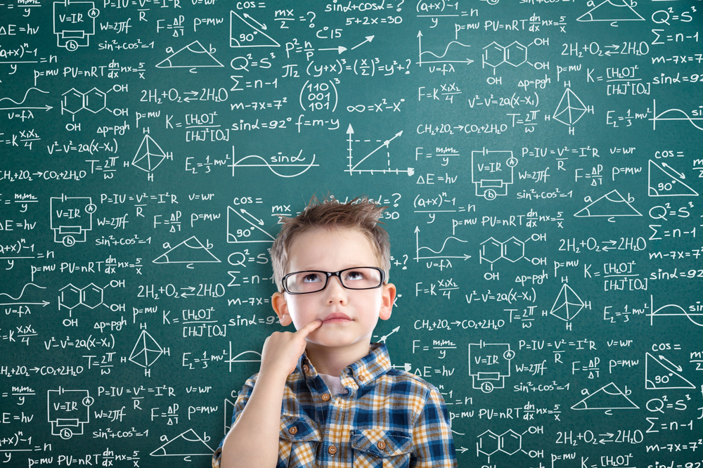 Student,Boy,On,Blackboard,Background,With,Formulas