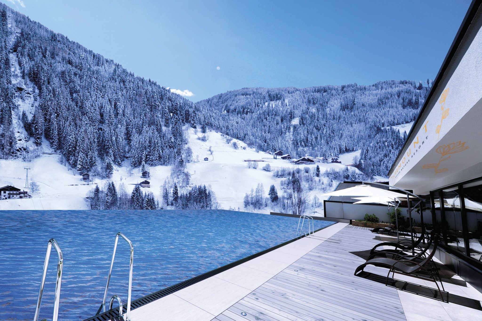 infinity-outdoorpool_mit_bergpanorama_im_winter_das_seemount
