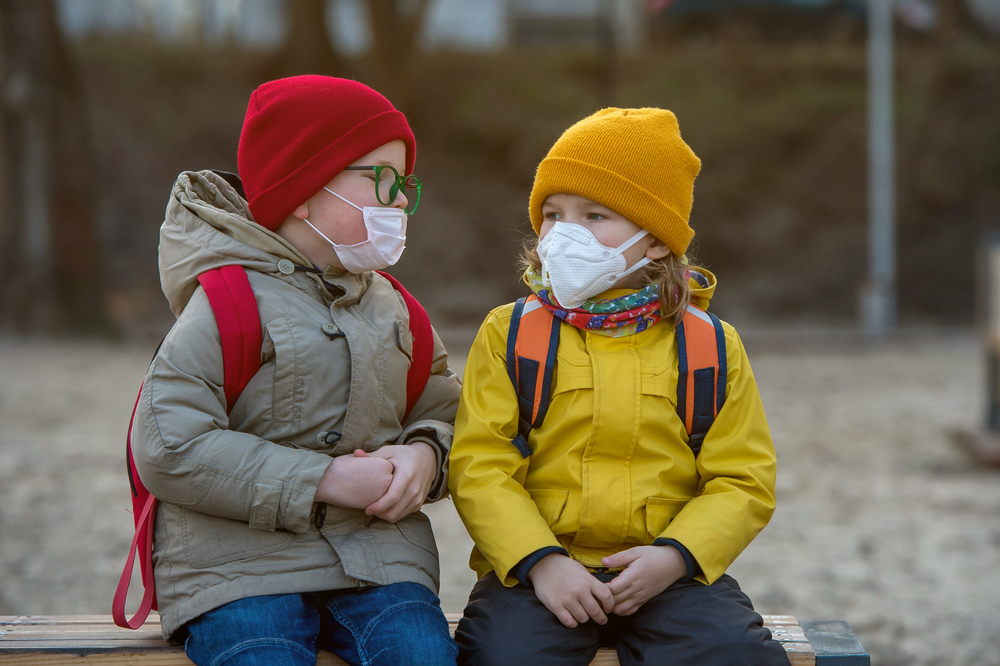 Child,Boy,And,Girl,Playing,Outdoors,With,Face,Mask,Protection.