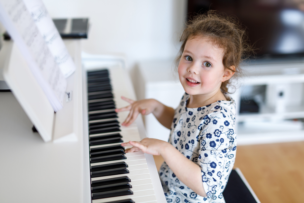 Beautiful,Little,Kid,Girl,Playing,Piano,In,Living,Room,Or