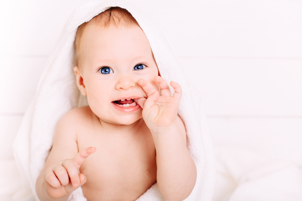 Cute,Baby,Of,8,Months,In,A,Big,White,Towel