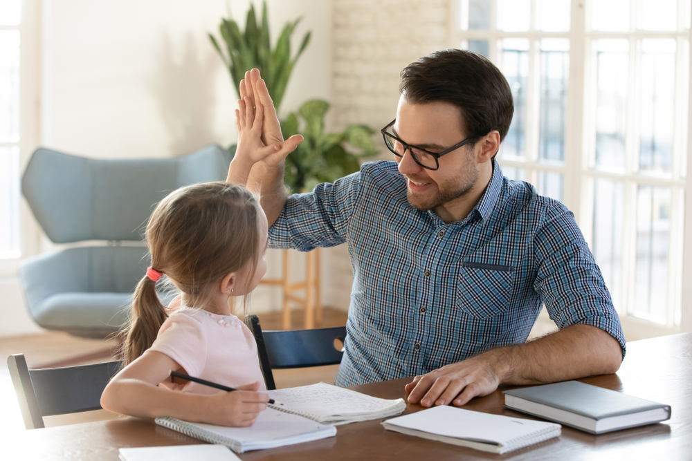 Happy,Young,Dad,Giving,High,Five,To,Smiling,Little,Daughter,