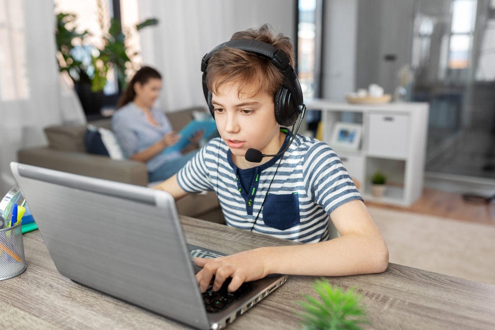 Gaming,,Education,And,School,Concept,-,Boy,With,Laptop,And