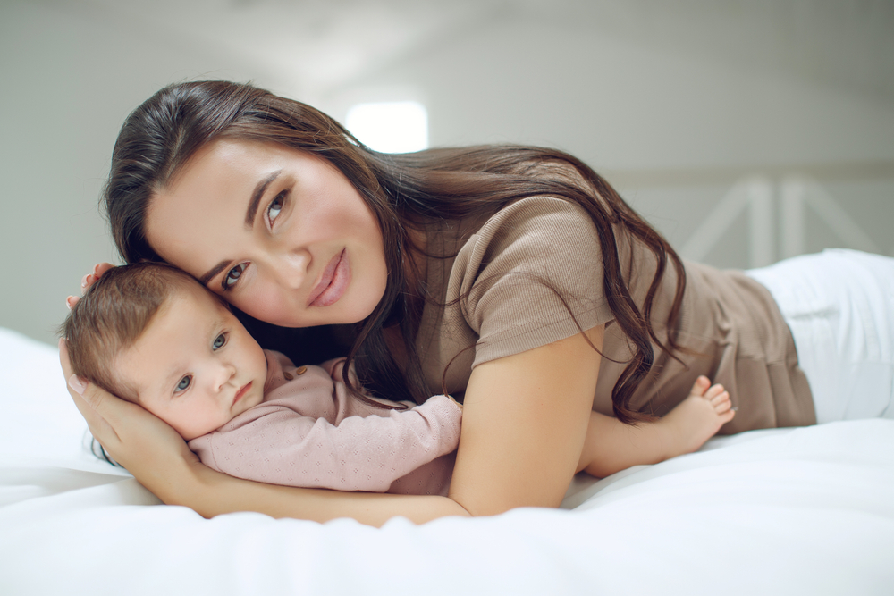 A,Young,Mother,Is,Holding,Her,Newborn,Baby.,Mother,Of