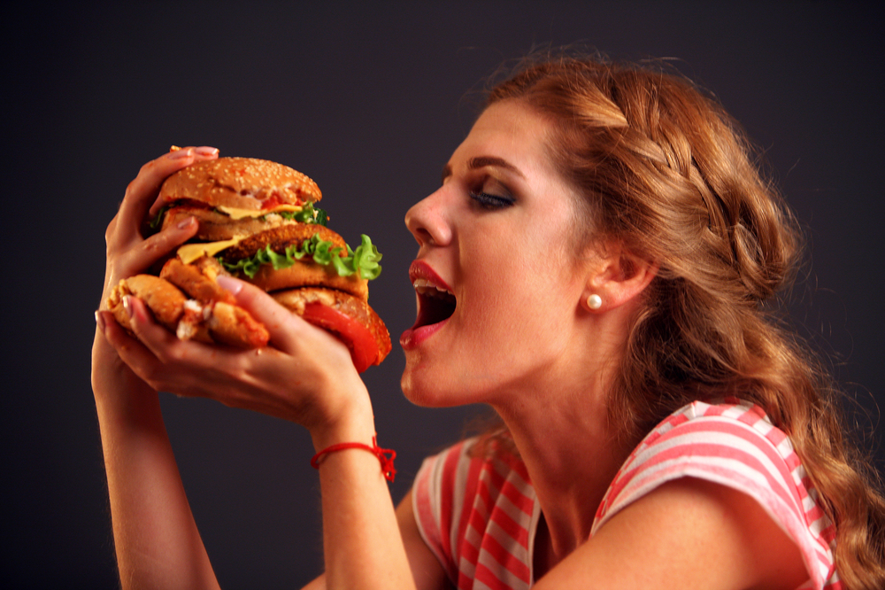 Woman,Eating,Sandwich.,Girl,With,Pleasure,Eats,Burger,After,Diet.