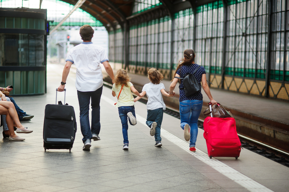 Family,Of,Four,People,Rushes,On,Platform,Of,Railway,Train