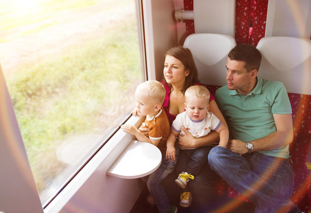 Family,With,Two,Sons,Travel,In,Train.