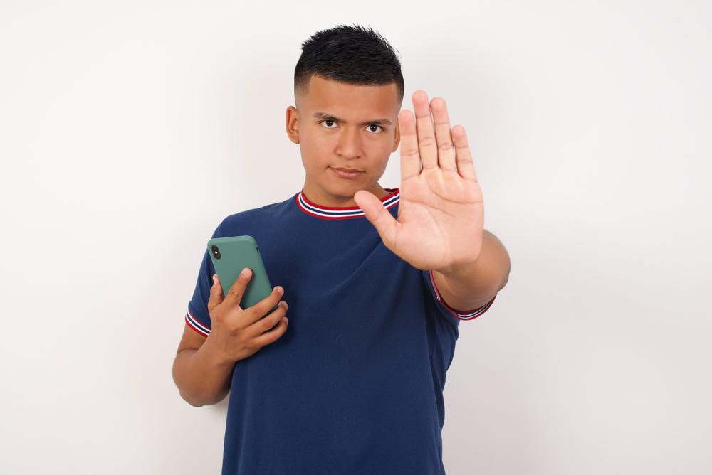 Young,Handsome,Hispanic,Man,Wearing,Casual,T-shirt,Standing,Over,White