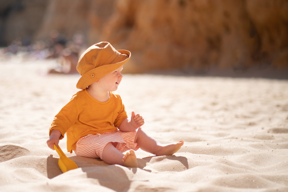 Cute,Baby,Playing,With,Sand,On,The,Beach.,Family,Vacation