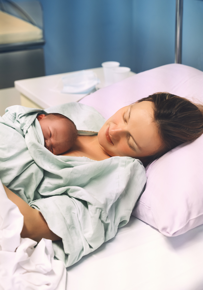 Mother,And,Newborn.,Child,Birth,In,Maternity,Hospital.,Young,Mom