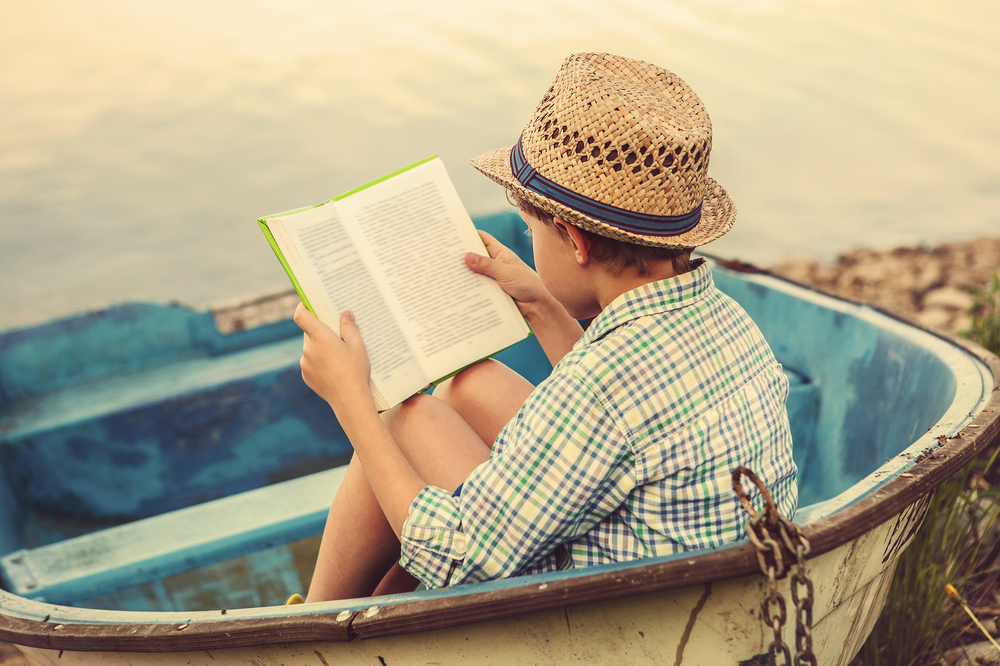 Reading,Boy,In,Old,Boat