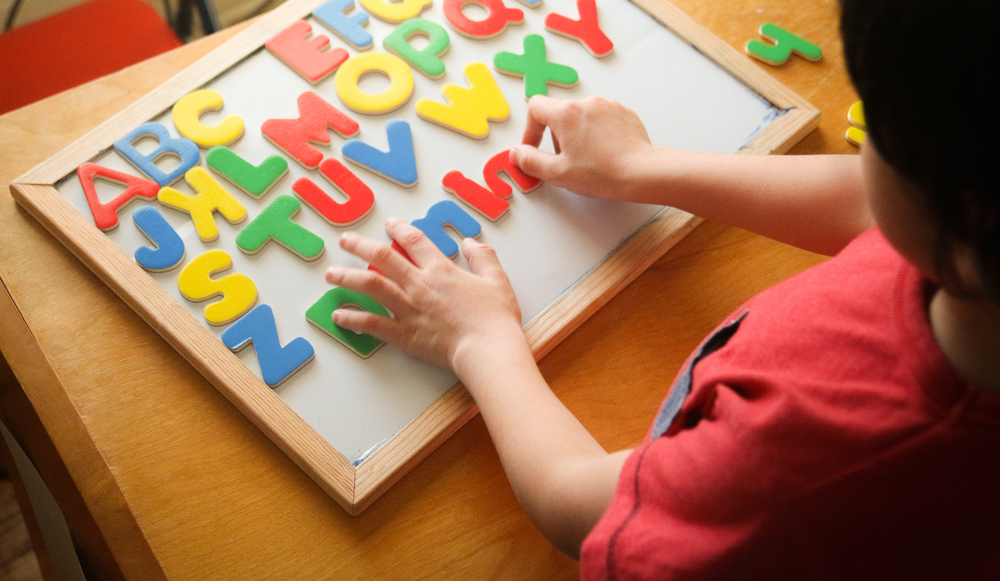 Kid,Is,Learning,The,Alphabets,At,Home.