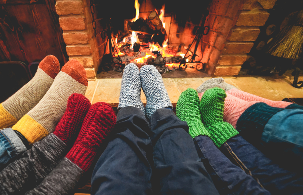Legs,View,Of,Happy,Family,Wearing,Warm,Socks,In,Front