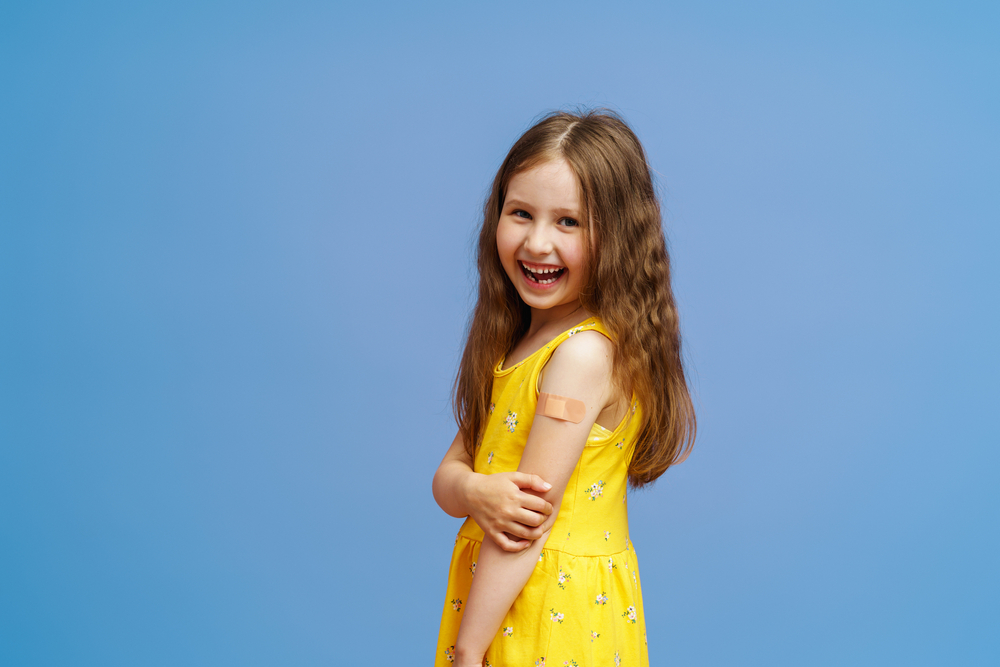 Happy,Smiling,Vaccinated,Little,Girl,Shows,Her,Hand,With,A