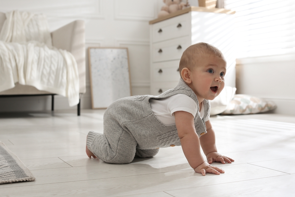 Cute,Baby,Crawling,On,Floor,At,Home
