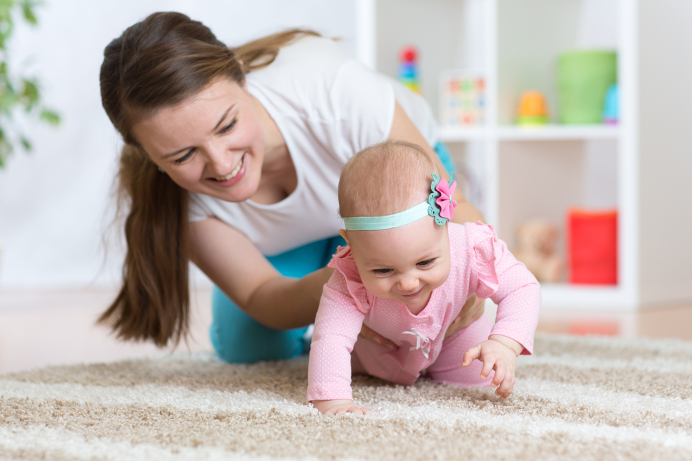Funny,Crawling,Baby,Girl,With,Mother
