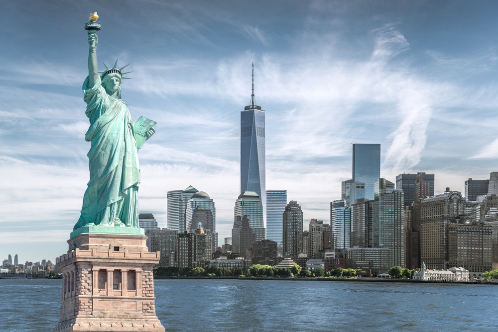 The,Statue,Of,Liberty,With,World,Trade,Center,Background,,Landmarks