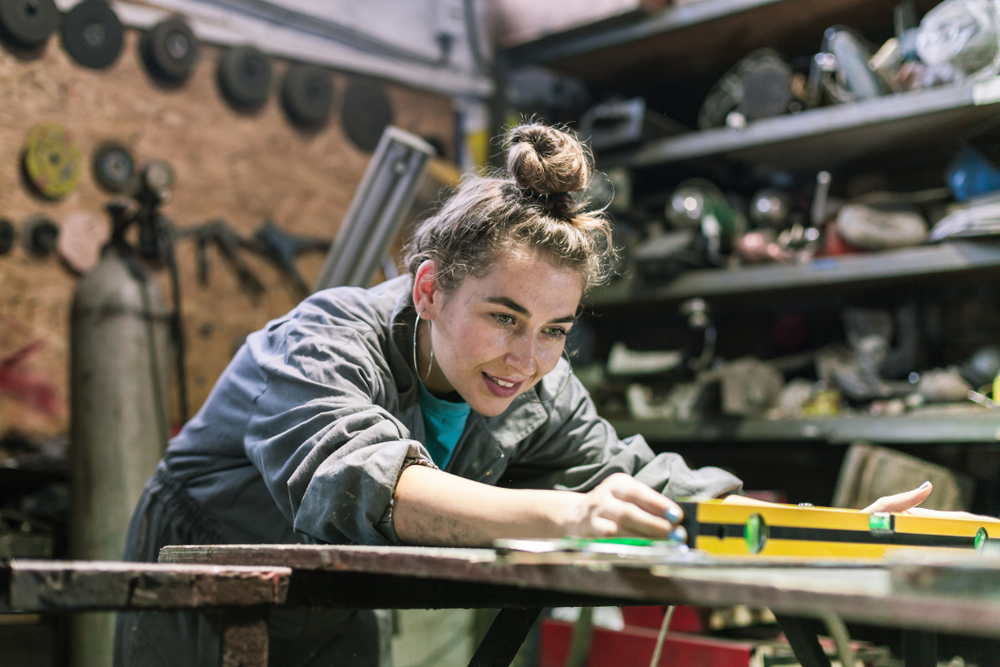 Young,Woman,Working,In,A,Workshop