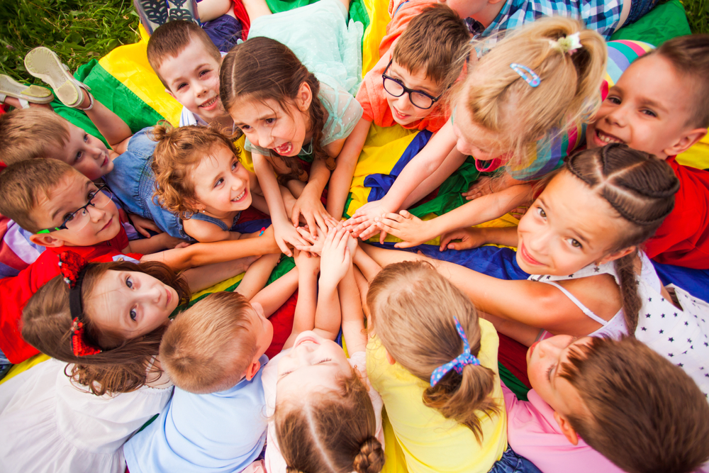 Top,View,Kids,In,Circle,Laying,On,Colorful,Cloth