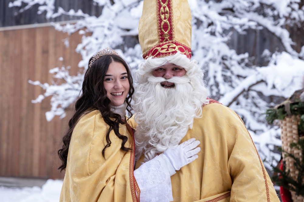 Young,Woman,Smiles,With,Saint,Nicholas,During,Winter,Holiday,Celebration