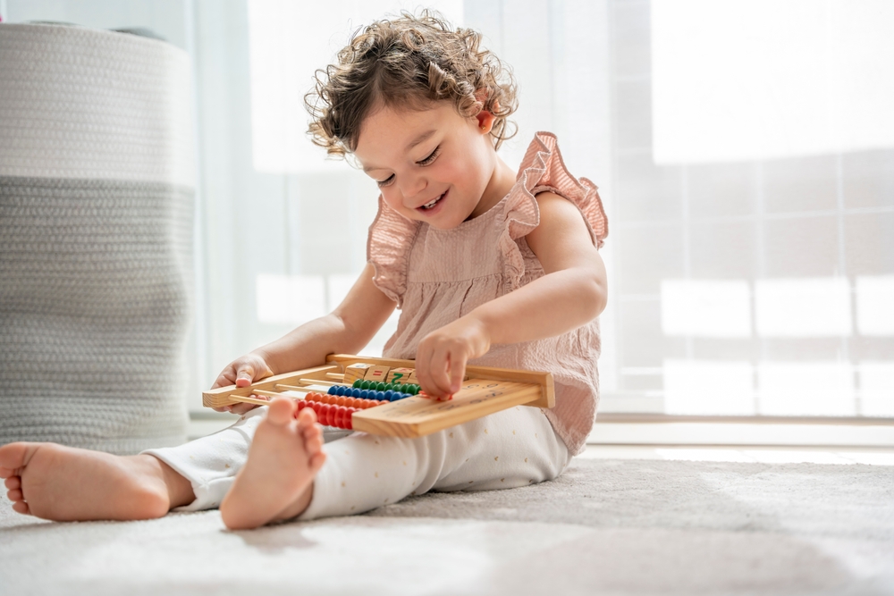 Horizontal,Image,Of,A,Baby,Girl,Enjoying,Playing,In,Her