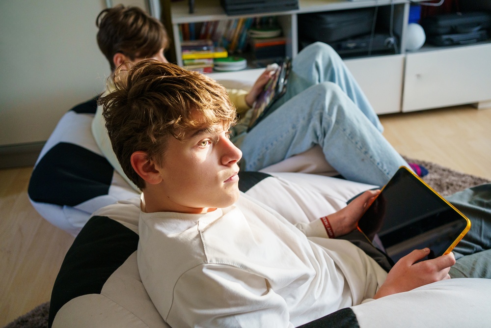 Two,Teenager,Boys,Doing,School,Homework,On,Tablet.,Teen,Children